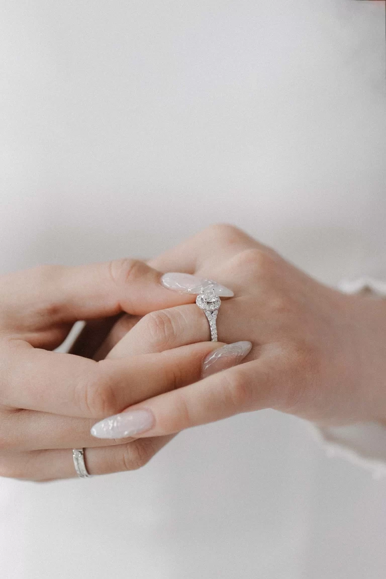 Elegant engagement rings featuring a sparkling solitaire diamond with a delicate pavé band, symbolizing timeless love and commitment.